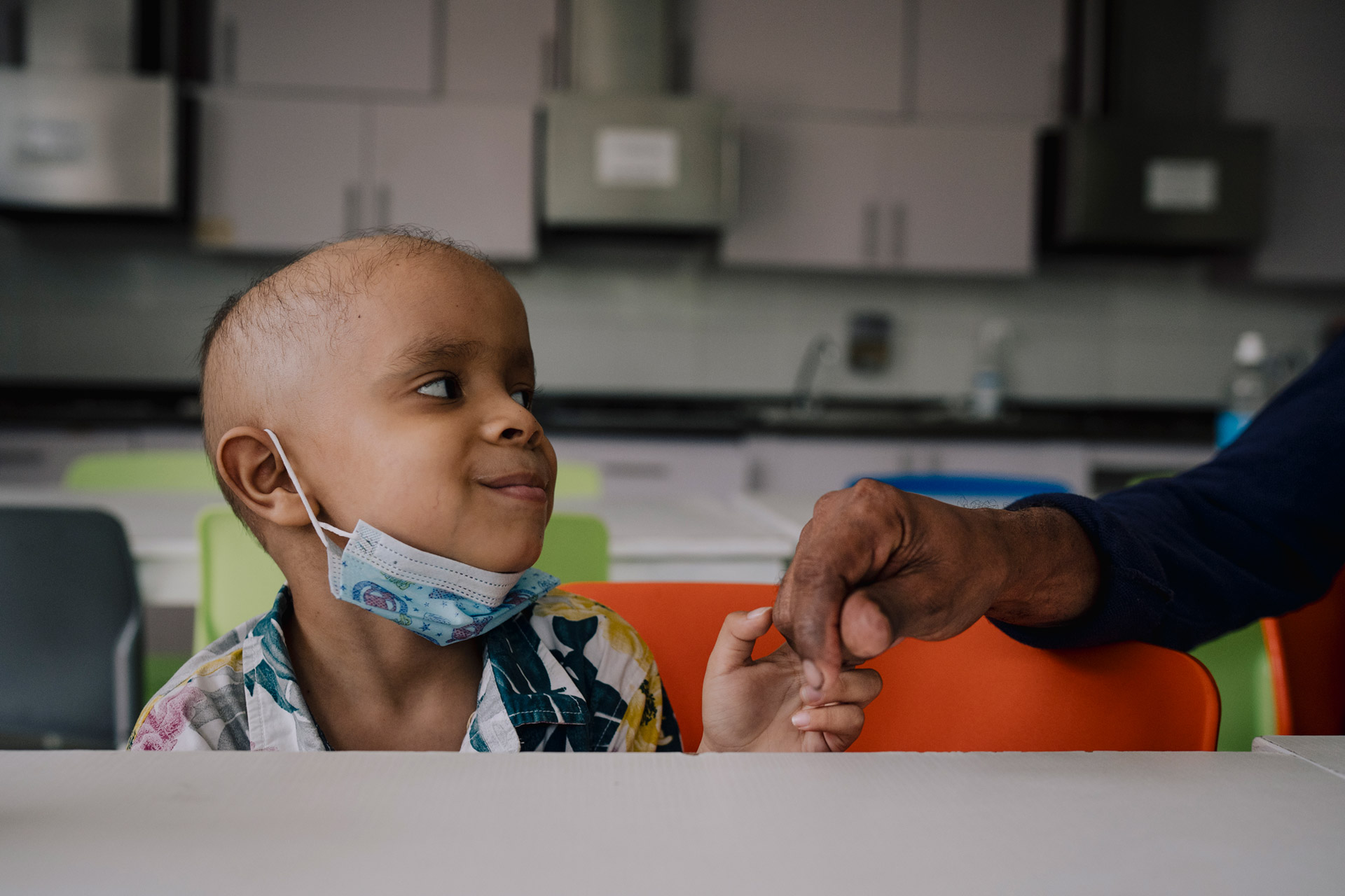 Smiling Child Holding Hand