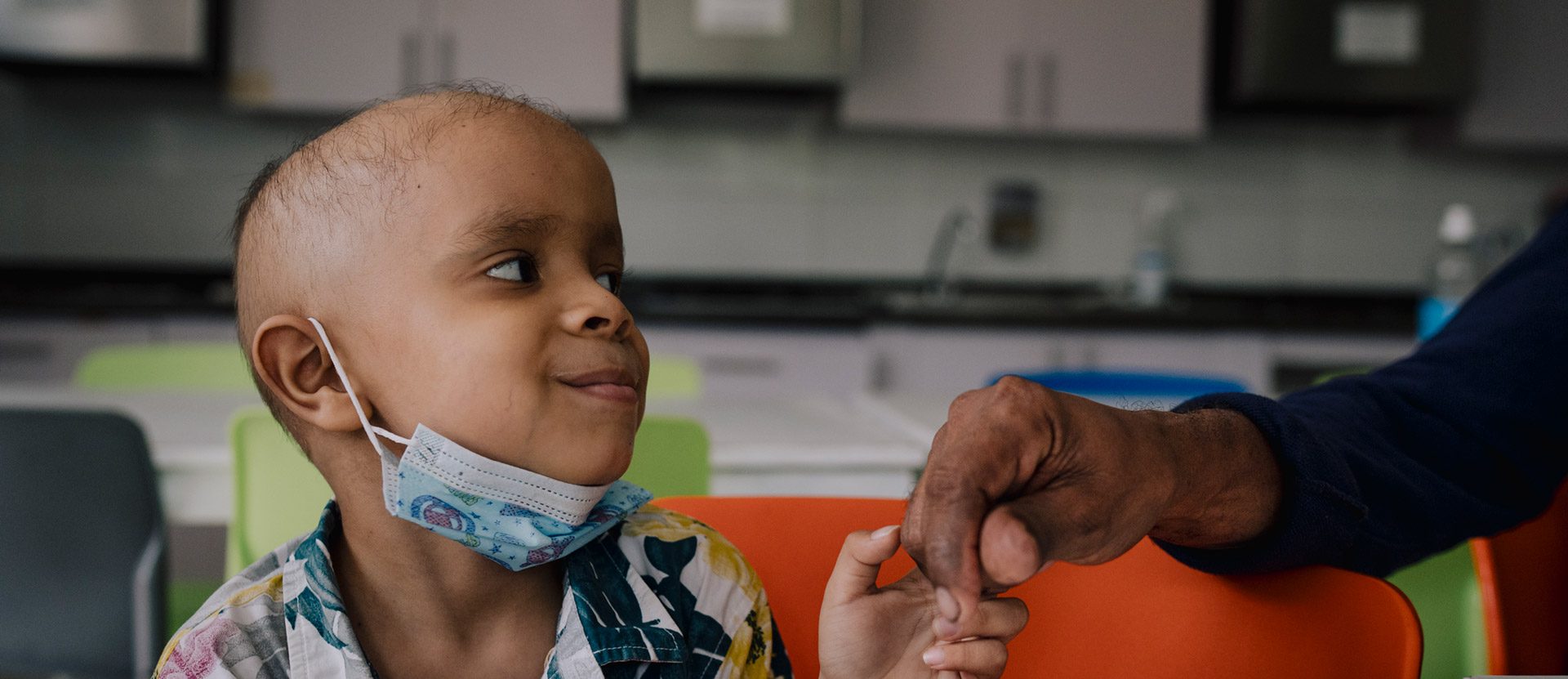 Smiling Child Holding Hand